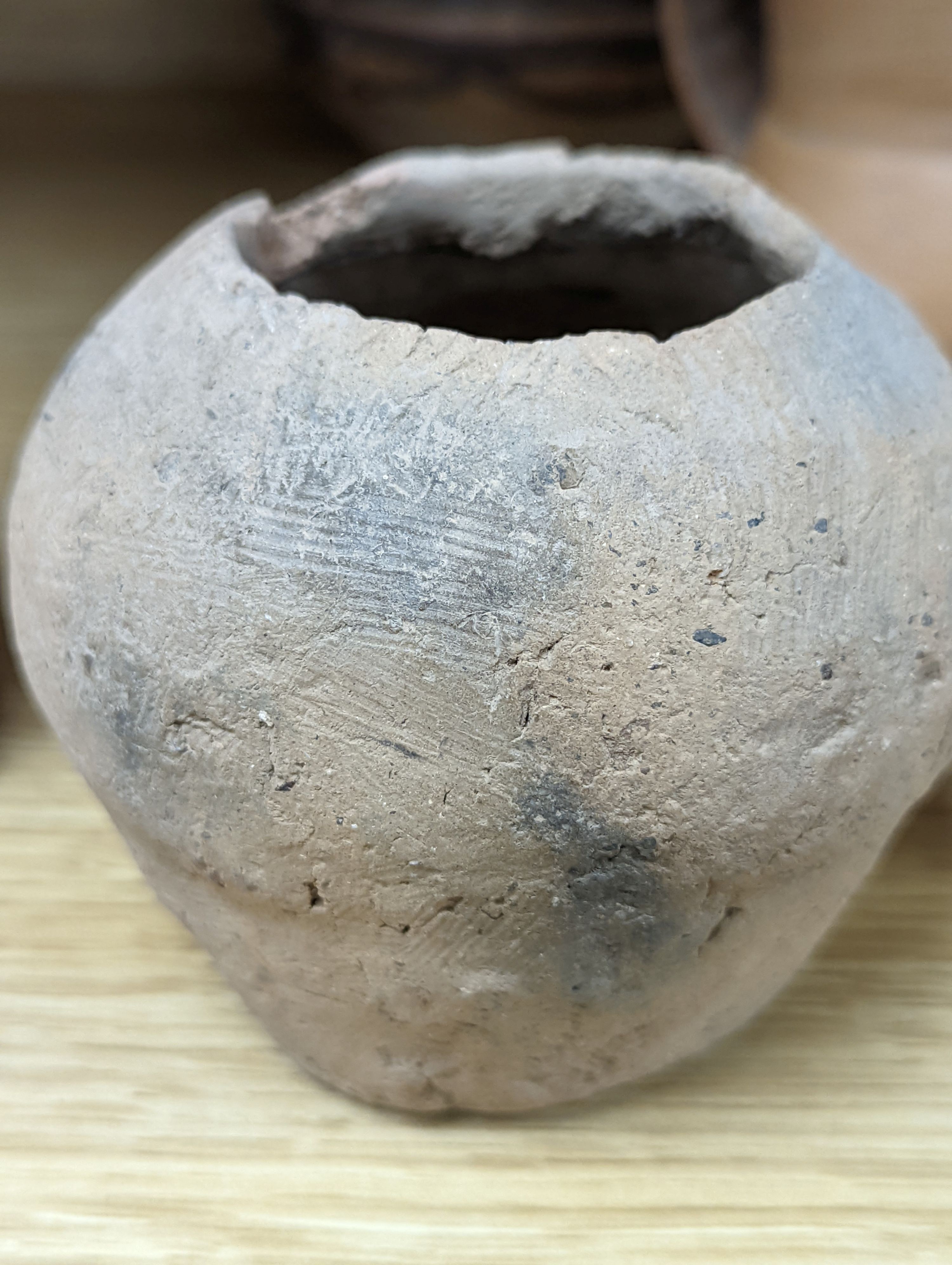 Four Chinese Neolithic pottery vessels, 11cm